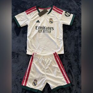 Real Madrid Kids White Jersey & Shorts with Green and Burgundy Accents